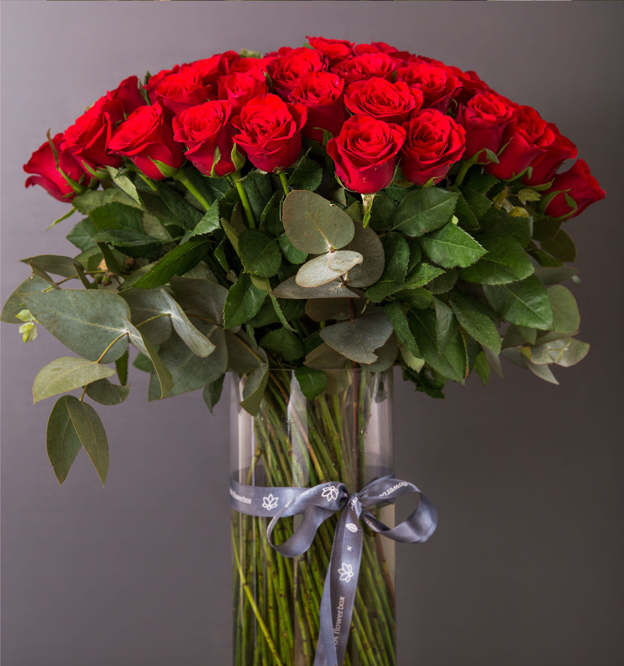 Vibrant tropical bouquet with exotic flowers arranged by Flowerbox